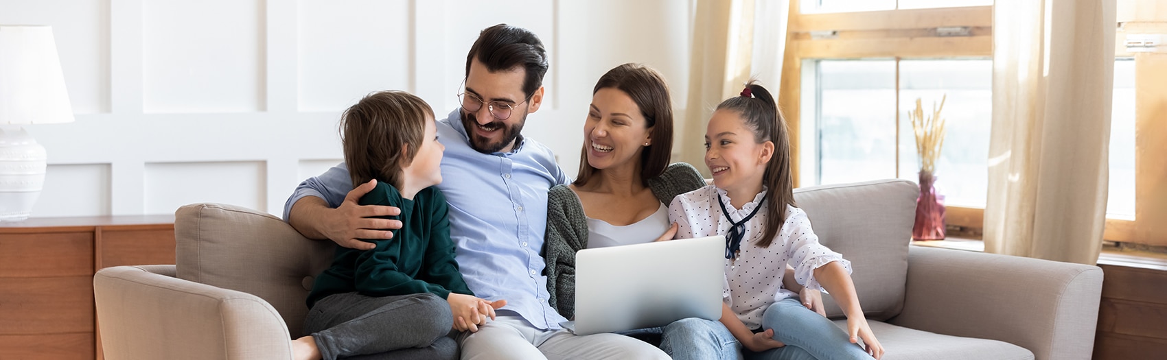 Therapy for parents - photo features a family of four with a father, mother and two children one male and one female